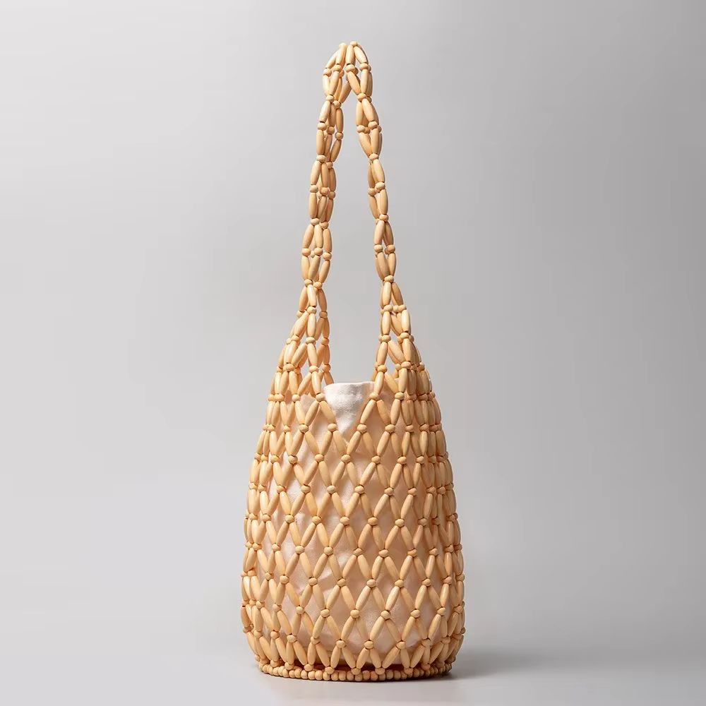 Sac tissé Design exquis évider perle de bois fourre-tout seau sac à bandoulière femme été plage sac 