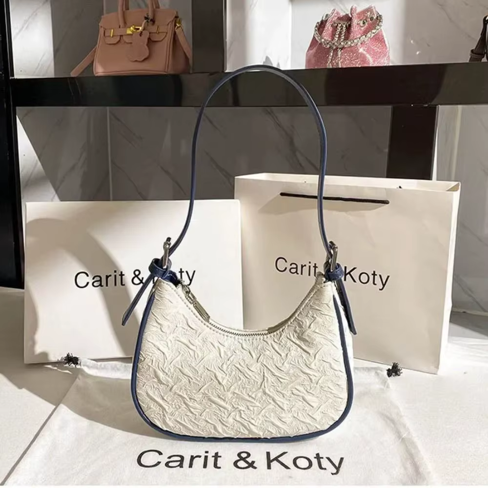 Sac plissé tendance de l'année, design original et raffiné, sac croissant pour femme, design de nich