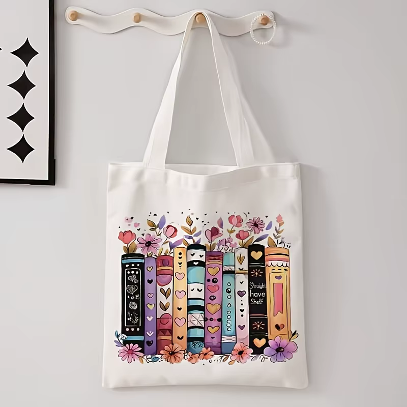 Sac fourre-tout en toile imprimé avec des motifs de fleurs et de livres, adapté à un usage quotidien