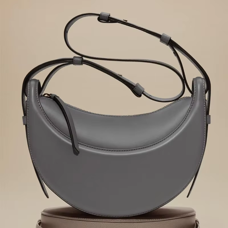 Sac à bandoulière en cuir véritable pour femme, modèle croissant, design de niche, fermeture éclair,