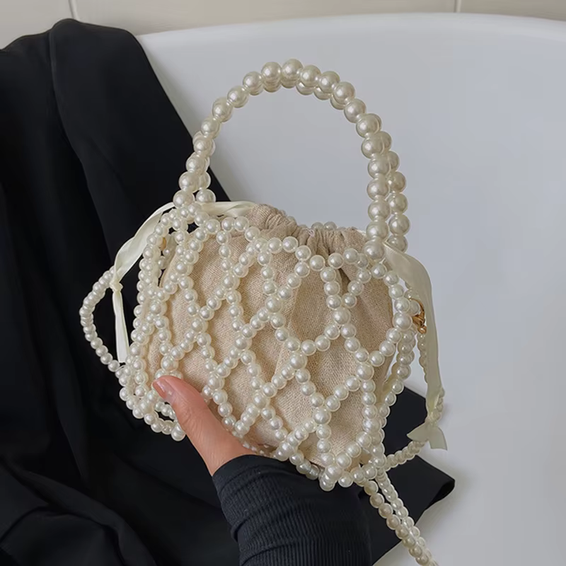 Sac à main rétro français fée populaire tissé perlé sac seau sac à bandoulière été Niche Design évidé
