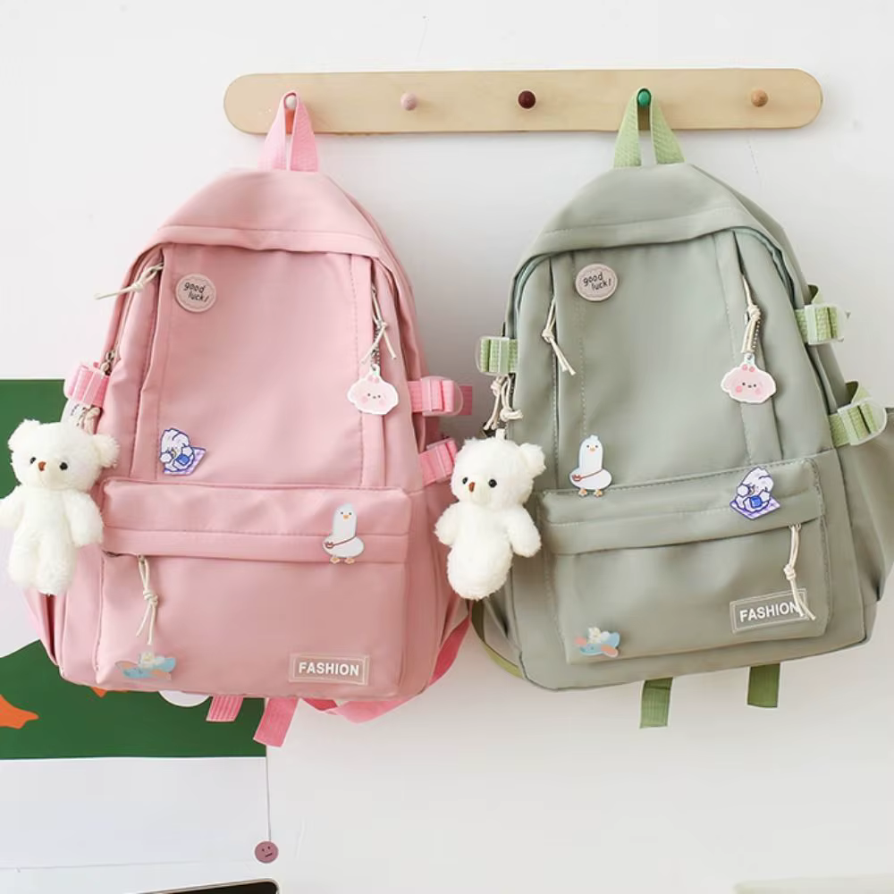Nouveau sac d'école de grande capacité Portable couleur unie sac à dos léger sangle réglable sac de voyage en toile unisexe