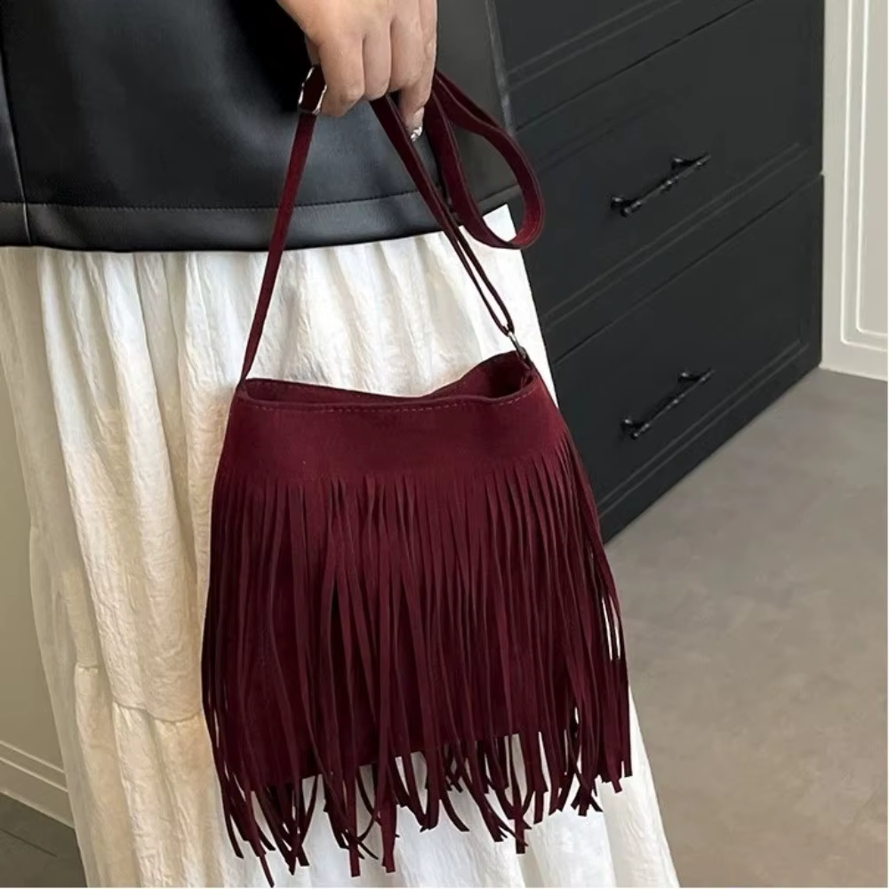 Sac bandoulière vintage en suède à franges