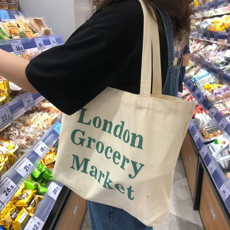 Sac pour femmes pas cher décontracté grande capacité sacs à bandoulière Shopper toile lettre mode Harajuku fermeture