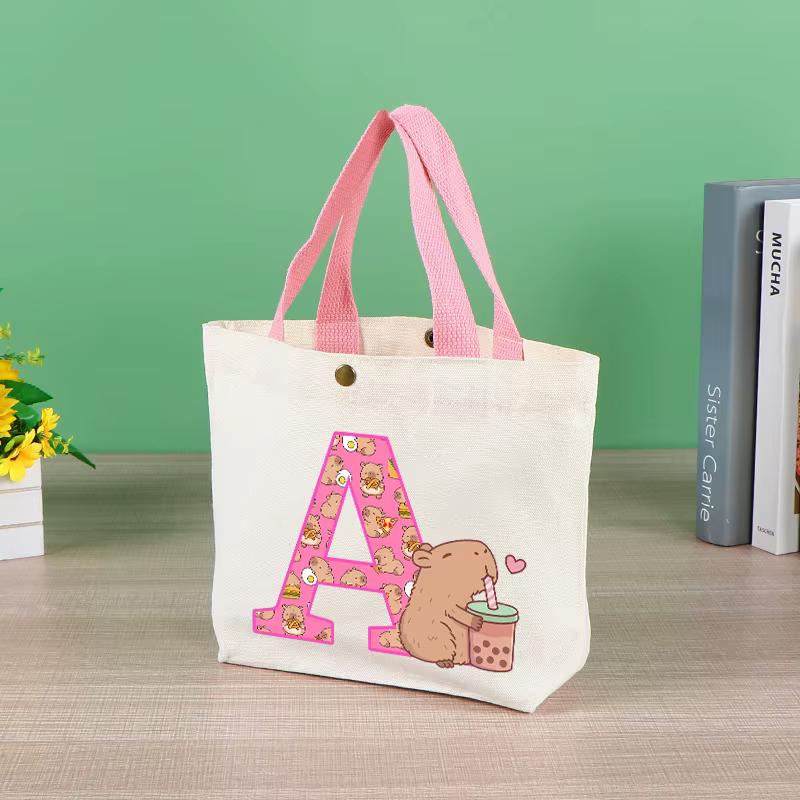 Capibara mignon sac fourre-tout pour femmes Anime Capybara lettre A-Z sac à main filles Shopping voyage organiser toile pochette cadeau offres spéciales