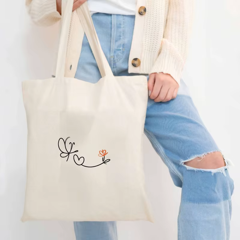 Sac à main en toile crème avec motif papillon