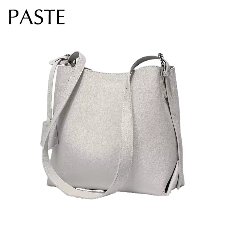 2025 Beige bleu couleur unie Design Simple sac seau en cuir de vachette femmes sac à bandoulière de haute qualité daim intérieur sac de messager