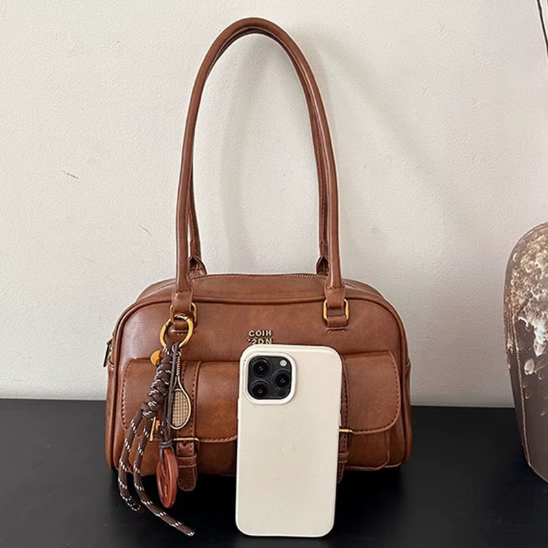 Sac à bandoulière rétro en cuir de couleur unie pour femmes