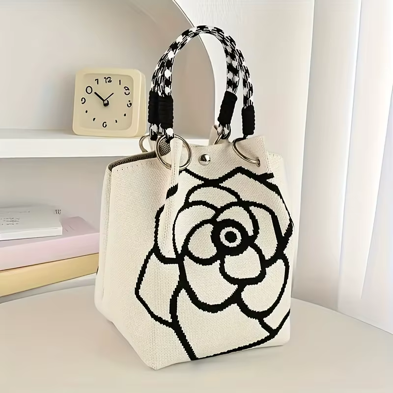Sac à main tricoté à motif de fleurs noir et blanc