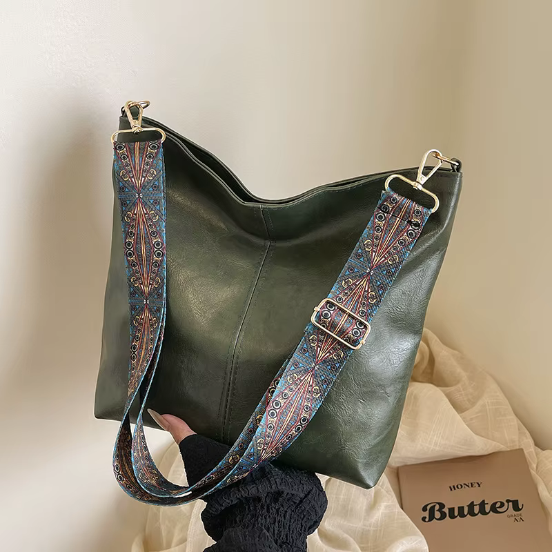 Nouvelle mode européenne et américaine fourre-tout épaule et bandoulière grande capacité sac seau couleur unie PU sac pour femmes tendance de rue