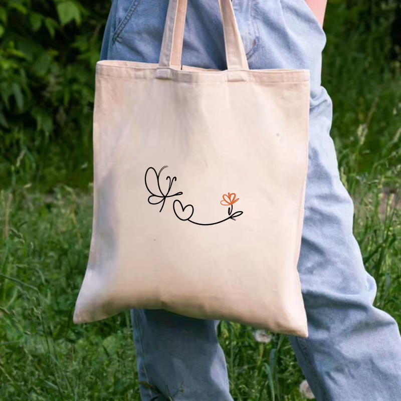 Sac à main en toile crème avec motif papillon