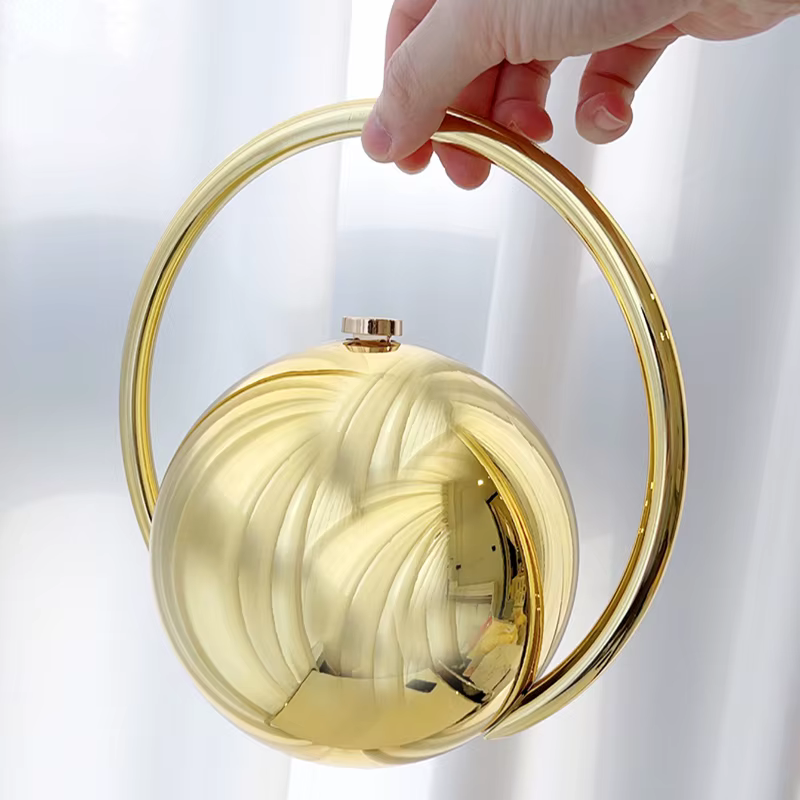 Pochette de soirée de luxe de styliste avec poignée en boule