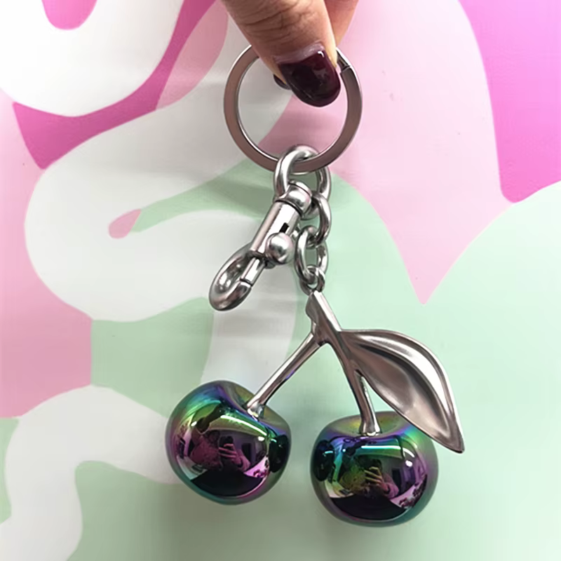 Pendentif cerise de couleur dégradée pour sac à main d'entraîneur