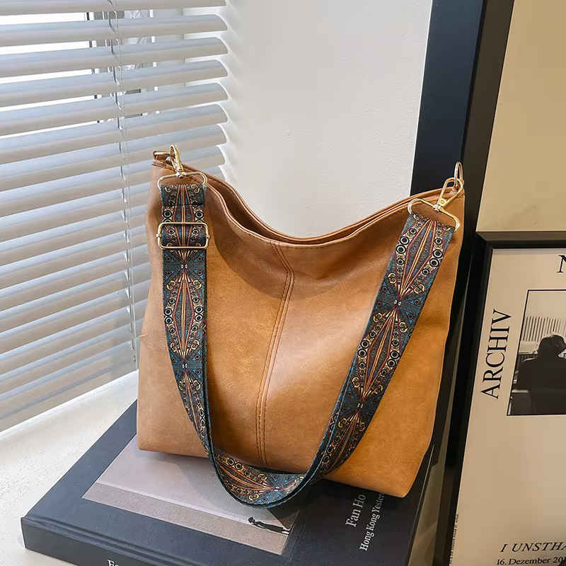 Nouvelle mode européenne et américaine fourre-tout épaule et bandoulière grande capacité sac seau couleur unie PU sac pour femmes tendance de rue