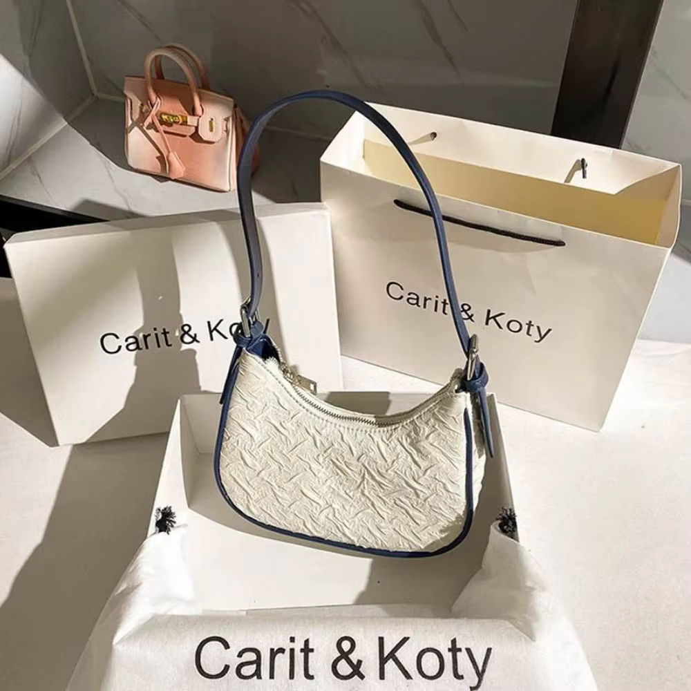Sac plissé tendance de l'année, design original et raffiné, sac croissant pour femme, design de niche estival, sac porté épaule
