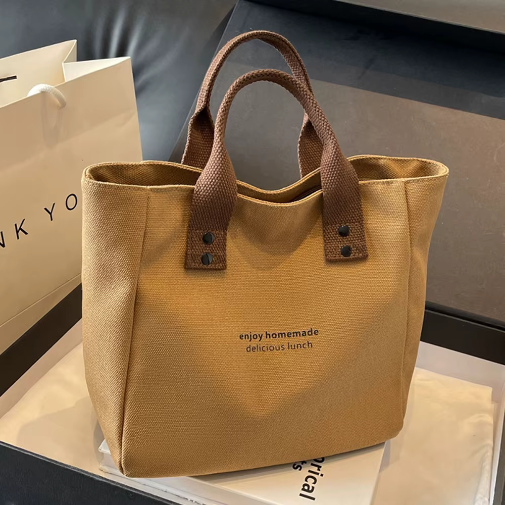 Sac fourre-tout décontracté en toile avec pendentif cloche et fermeture éclair ; ce sac