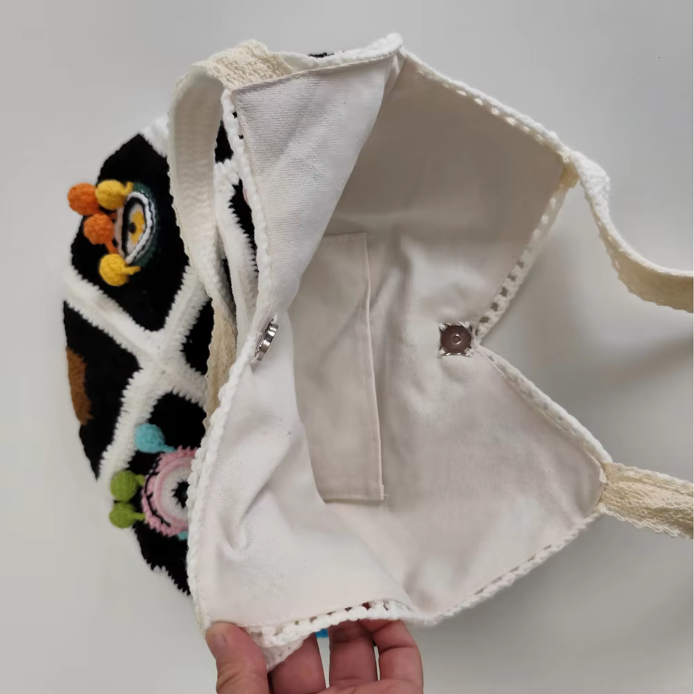 Sac à bandoulière en Crochet fait à la main avec fleur de monstre aux grands yeux