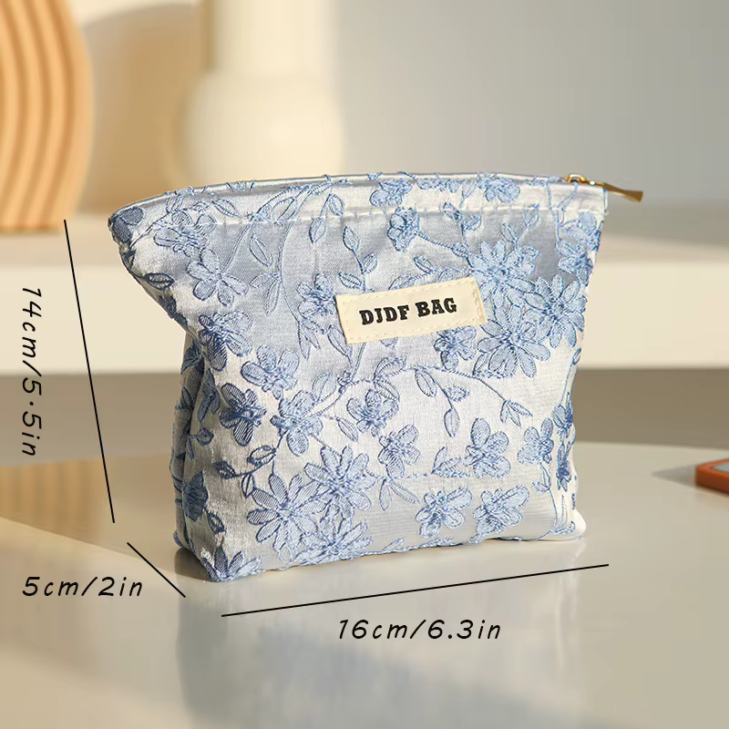 Nouveau sac cosmétique femme de petite taille Portable bleu broderie Mini sac de rangement de serviettes hygiéniques sac de clé de monnaie de banlieue sac de carte bancaire