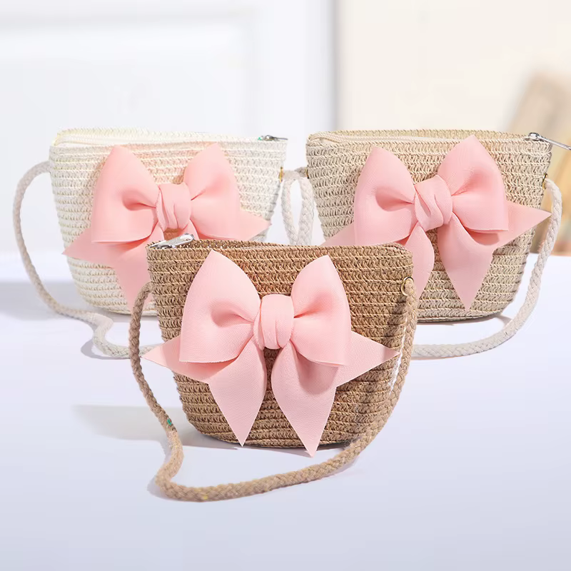 Sac à bandoulière rose avec nœud papillon pour fille