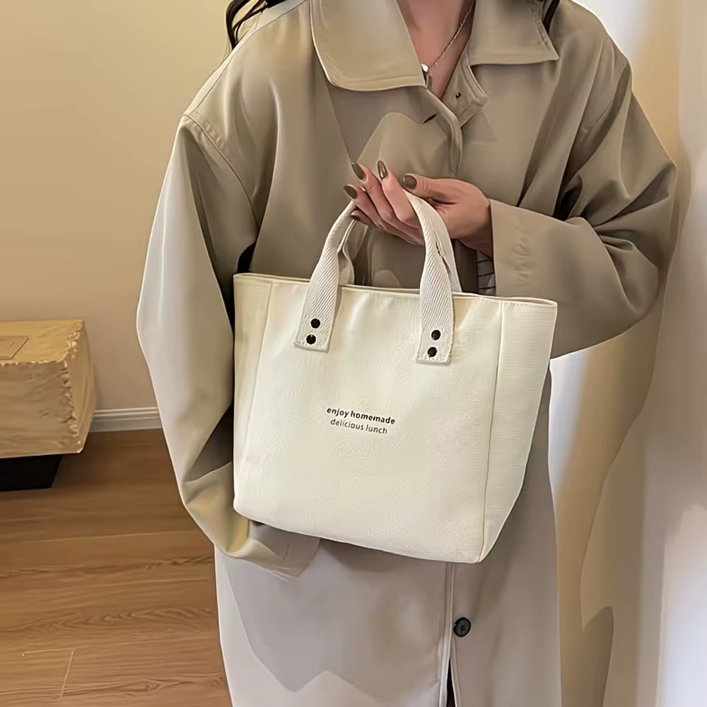 Sac fourre-tout décontracté en toile avec pendentif cloche et fermeture éclair ; ce sac