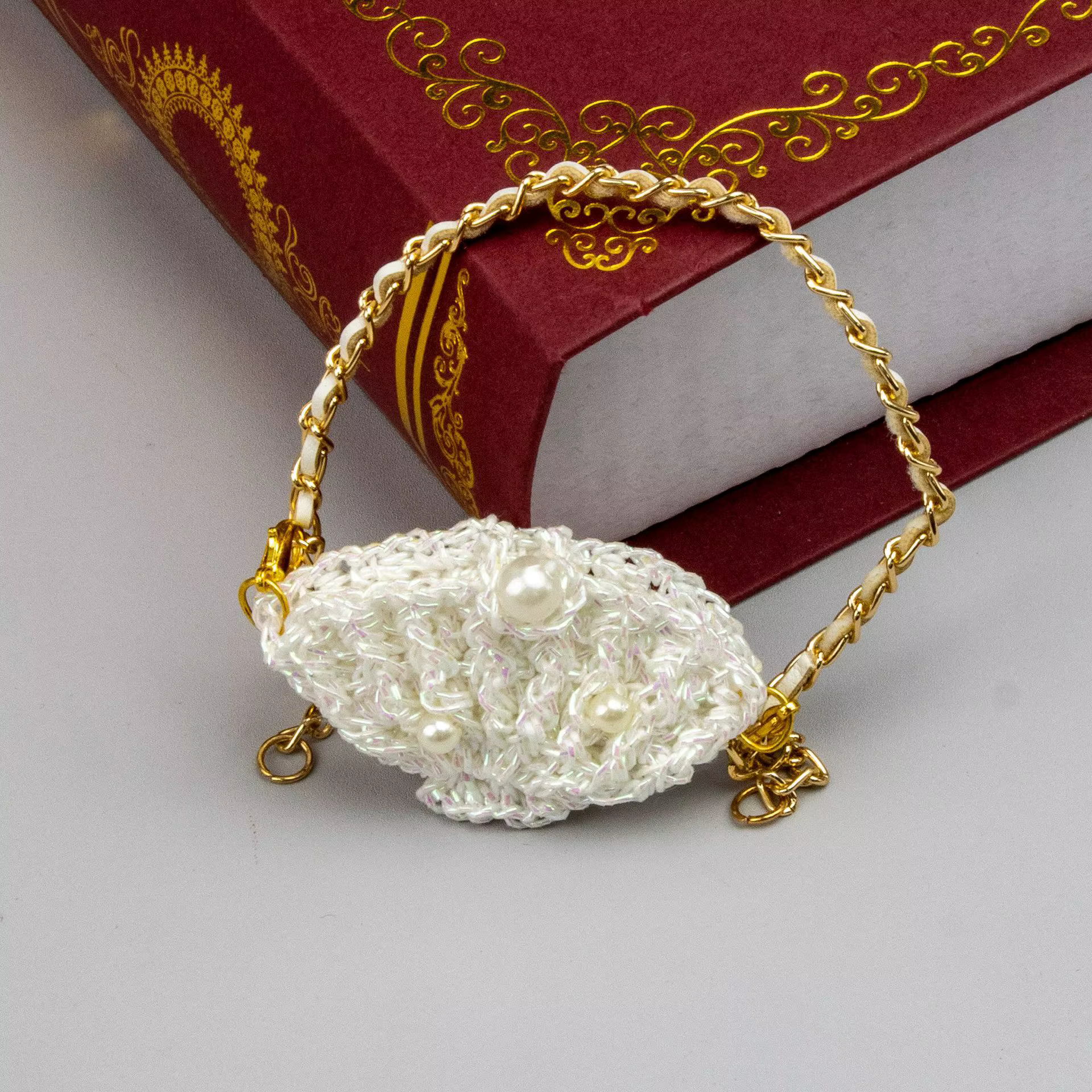 Petit sac carré en cuir tricoté à double poche