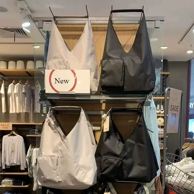 Sac à main en toile noire et beige